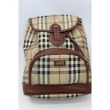 Burberry check leather rucksack with top stitched leather trims, adjustable fabric shoulder straps,