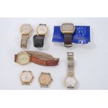 Two gold plated Ebel wristwatches and five other watches