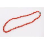 Old Chinese coral necklace with barrel shaped polished beads and oval silver clasp
