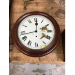 Victorian-style wall clock with white dial and Roman numerals