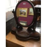 Victorian mahogany oval dressing table mirror on scroll supports