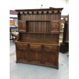 Reproduction elm two height dresser with panelled doors and three drawers on bracket feet