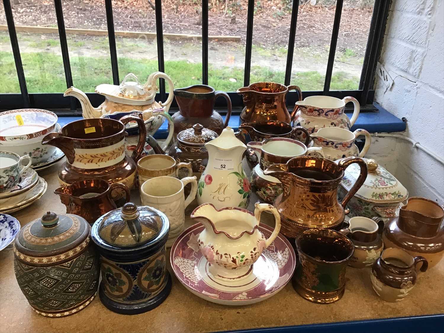 Collection of mostly 19th century ceramic jugs, teapots