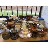 Collection of mostly 19th century ceramic jugs, teapots