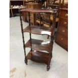 Victorian rosewood serpentine fronted four tier whatnot