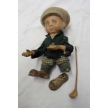 Rare 1920s plaster golfing figure, wearing plus fours and cap