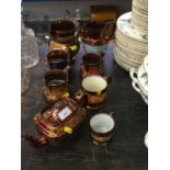 Collection of 19th century copper lustre jugs, tea ports etc