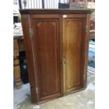 George III inlaid mahogany corner cupboard