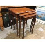 Nest of three mahogany tables