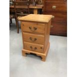 Two pine three drawer bedside chests