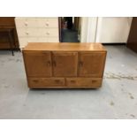 Ercol sideboard with three cupboards and two drawers below