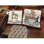 Two armorial tapestry cushions and one other