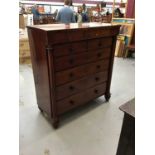 Victorian mahogany chest of two short and four long drawers flanked by columns on bun feet.