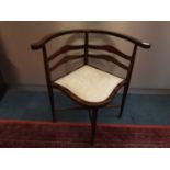 Mahogany corner chair with padded seat on turned legs joined by X frame stretchers