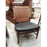 Stylish elbow chair with wicker back