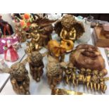 Gilt Cupid ornaments, large wooden Buddha mask and a wooden elephant ornament