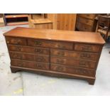 Reproduction mahogany sideboard with an arrangement of nine drawers