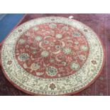 Circular floral rug on pink ground