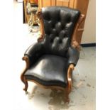 Victorian walnut framed armchair with buttoned black leather upholstery