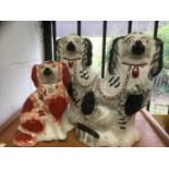 Pair of Staffordshire spaniels and one other