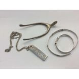 Pair silver wishbone sugar tongs, silver ingot pendant and two bangles