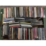 Box of various CDs and box videos