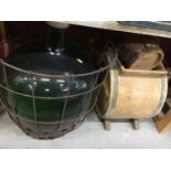 Carbon in wire frame with wooden butter churn and pail