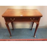 Georgian mahogany tea table with fold over top and drawer below on turned legs with pad feet