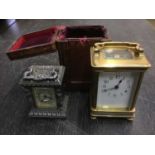 Brass carriage clock, and another smaller (the second cased)