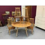 Good quality Ercol drop leaf dining table and four matching chairs