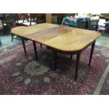 Georgian mahogany D end dining table with extra leaf on taper legs and brass castors