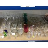 Large group of antique glassware to include Bristol Green, Cranberry, glass fly trap and others