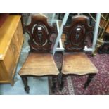 Pair of Victorian mahogany hall chairs and a pair of Edwardian occasional chairs