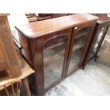 Victorian mahogany bookcase with shelved interior enclosed by two glazed doors