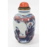 Chinese snuff bottle with coral top and hand shaped spoon