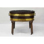 Georgian brass bound mahogany wine cooler, on carved legs and castors