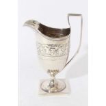 Regency silver milk jug of helmet form