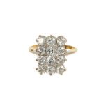 Antique diamond cluster ring with a rectangular plaque, set with twelve old cut diamonds and six fur