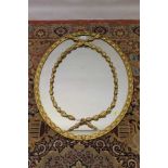 19th century oval gilt wall mirror.