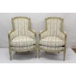Pair of French Louis XV style open armchairs each with cream painted show wood frame with striped up
