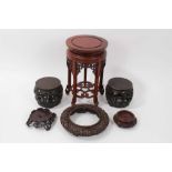 Pair of antique Chinese carved stands in the form of garden seats