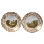 Pair of early 19th century Crown Derby plates, each painted with landscape scenes, one of Derbyshire