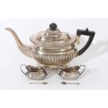 Edwardian silver teapot and two salts with spoons.