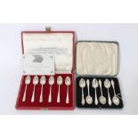 Two cased sets of six silver coffee spoons.