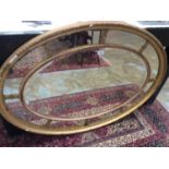 Antique oval gilt wall mirror