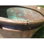 Copper vessel, with rounded base and stepped rim, 61cm diameter, together with a straight sided copp