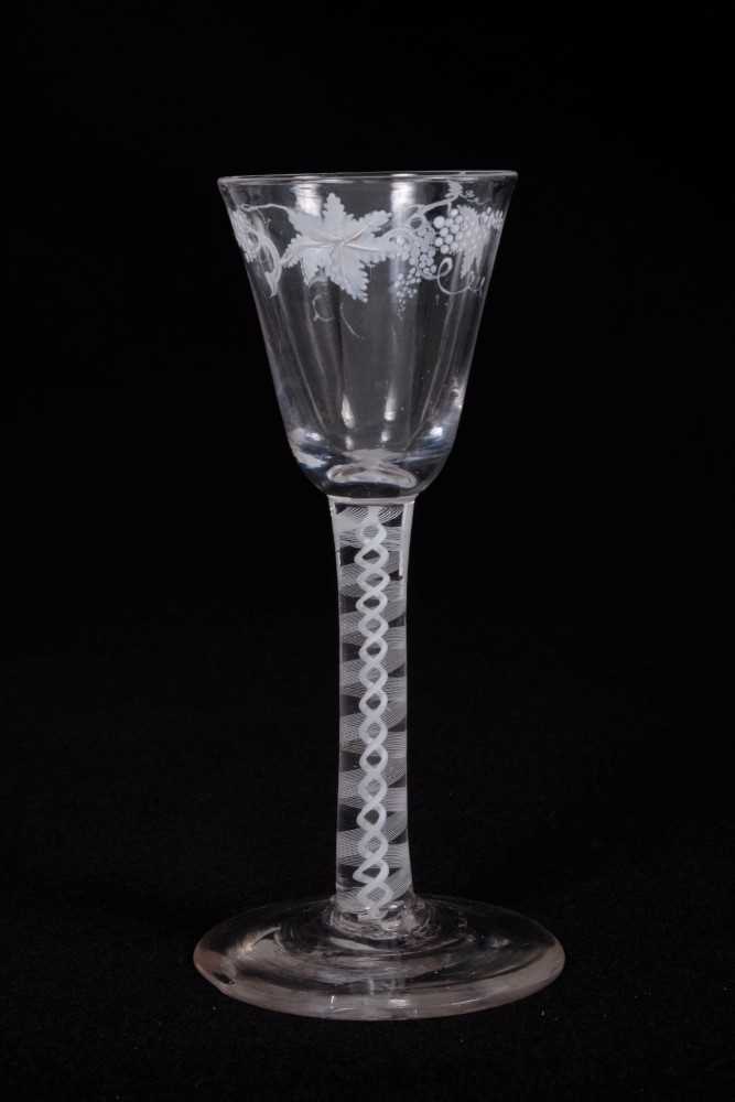 Fine Georgian wine glass, the funnel bowl painted in the Beilby style with grapevines in white ename