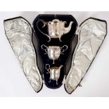 Edwardian silver three piece bachelor tea set by Walker & Hall in original fitted case.