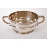 Large Edwardian silver two handled punch bowl of circular form.