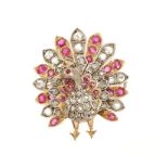 Victorian style diamond and ruby novelty brooch in the form of a peacock with rose cut diamonds and